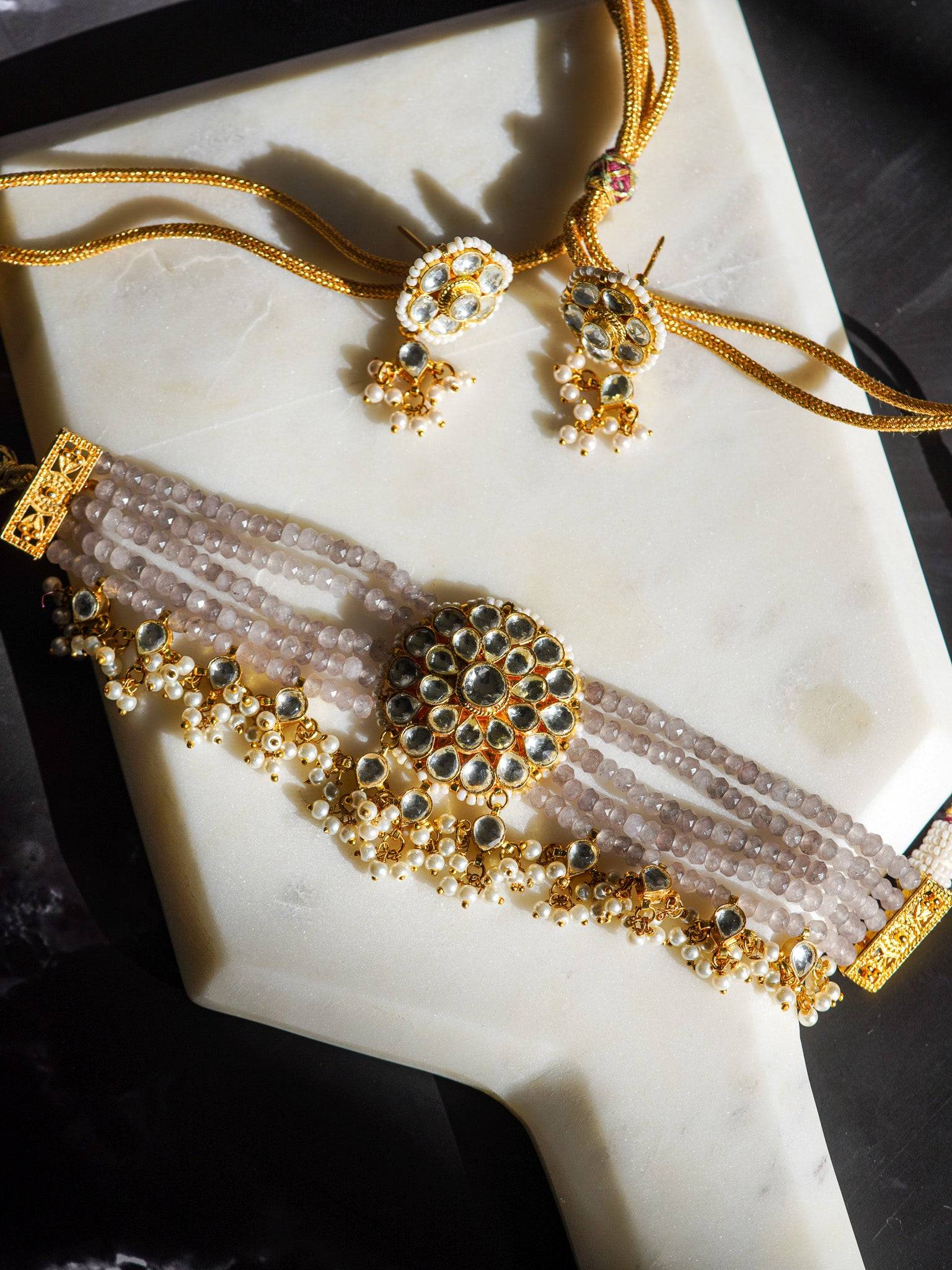 Indian Jewelry - Aaina Gold-Plated Kundan Choker Necklace Set with Lavender Beads, showcasing exquisite craftsmanship.