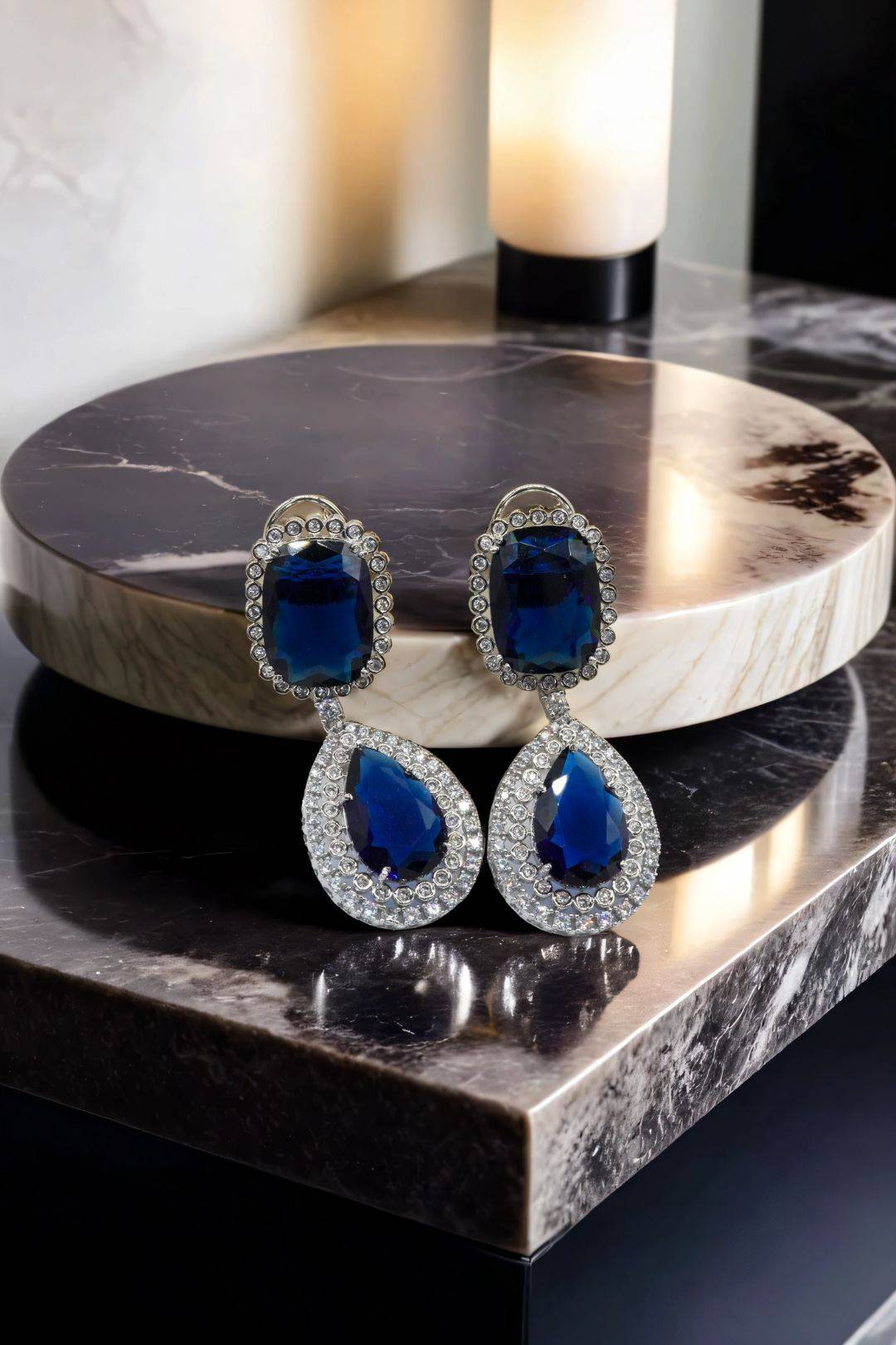 Sapphire Teardrop Statement Earrings and Necklace Set on Display