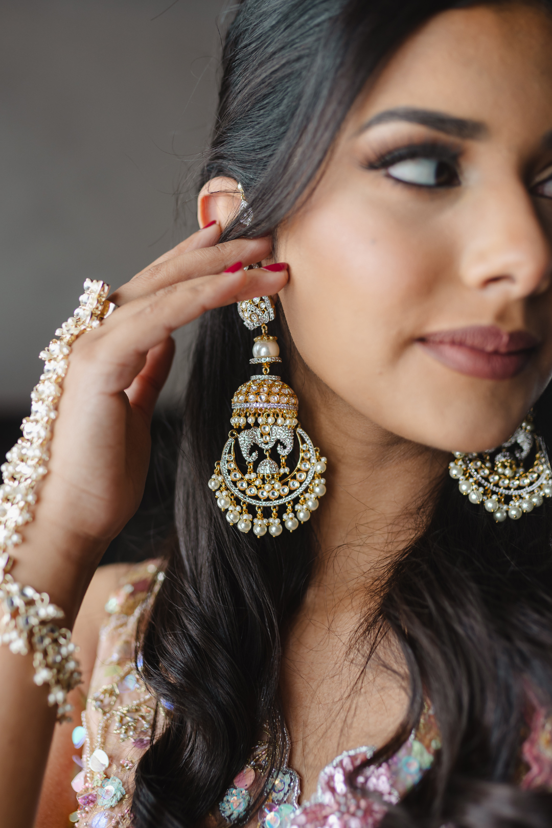 Aniva Moissanite Kundan earrings with intricate diamante details and faux pearl drops, ideal for weddings and festive occasions.