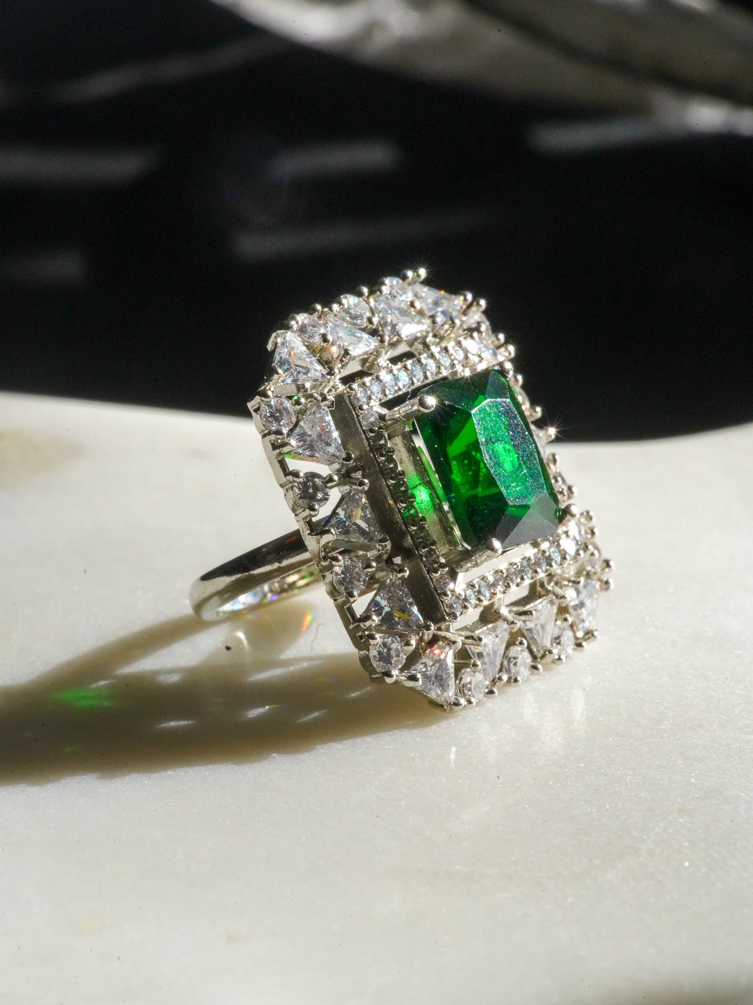 Ankita Rhodium-Plated Statement Ring with Emerald-Cut Gemstone and Halo Accents - Indian Jewelry