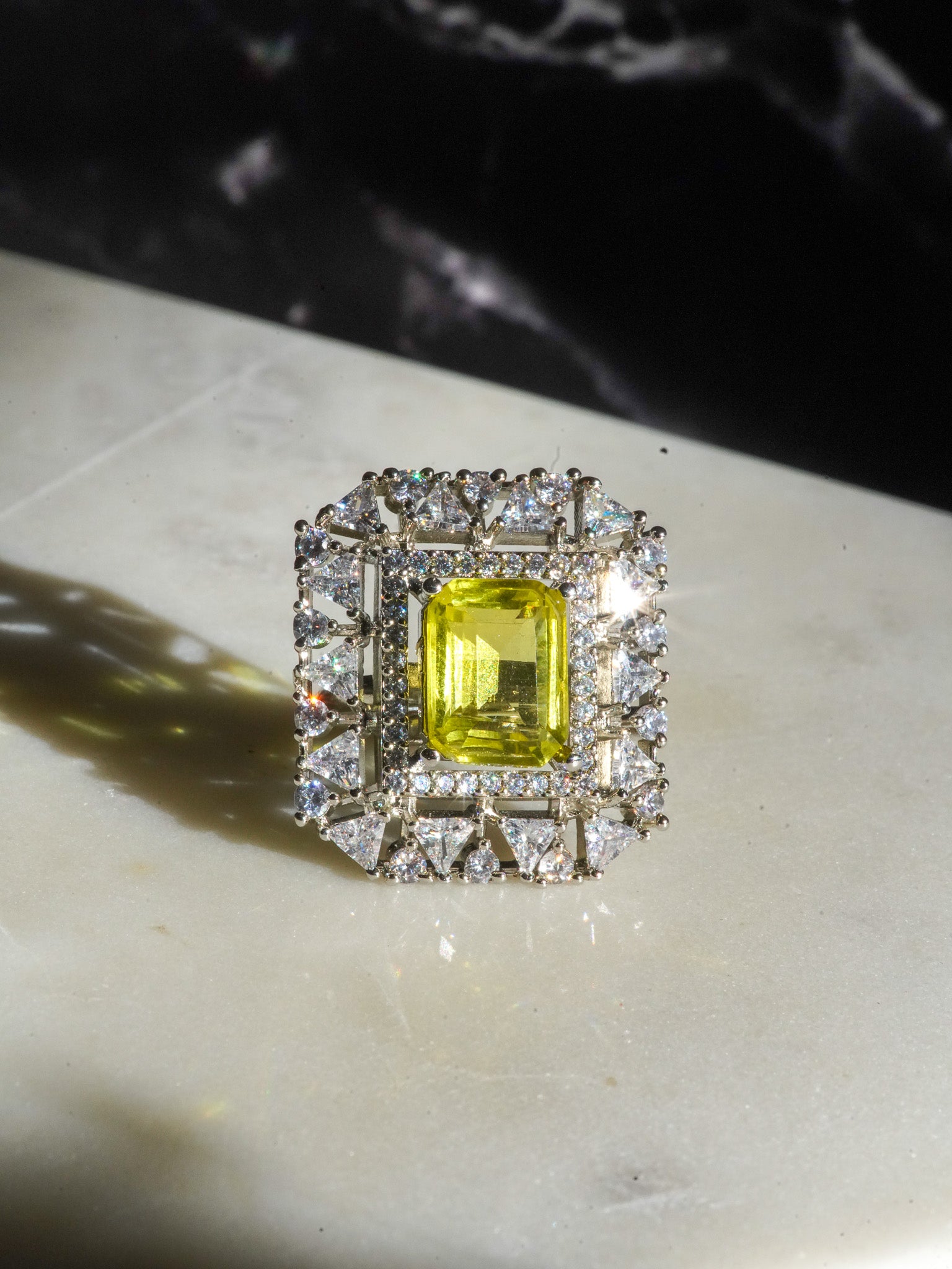 Ankita Rhodium-Plated Statement Ring with Emerald-Cut Gemstone and Halo Accents - Indian Jewelry