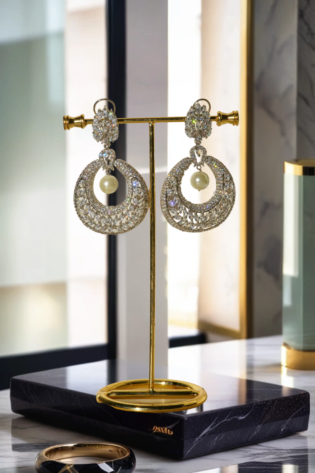 Esmeralda rhodium-plated crescent earrings with white stones and pearl drop, Indian jewelry, 2.8 inches long, for parties and weddings.