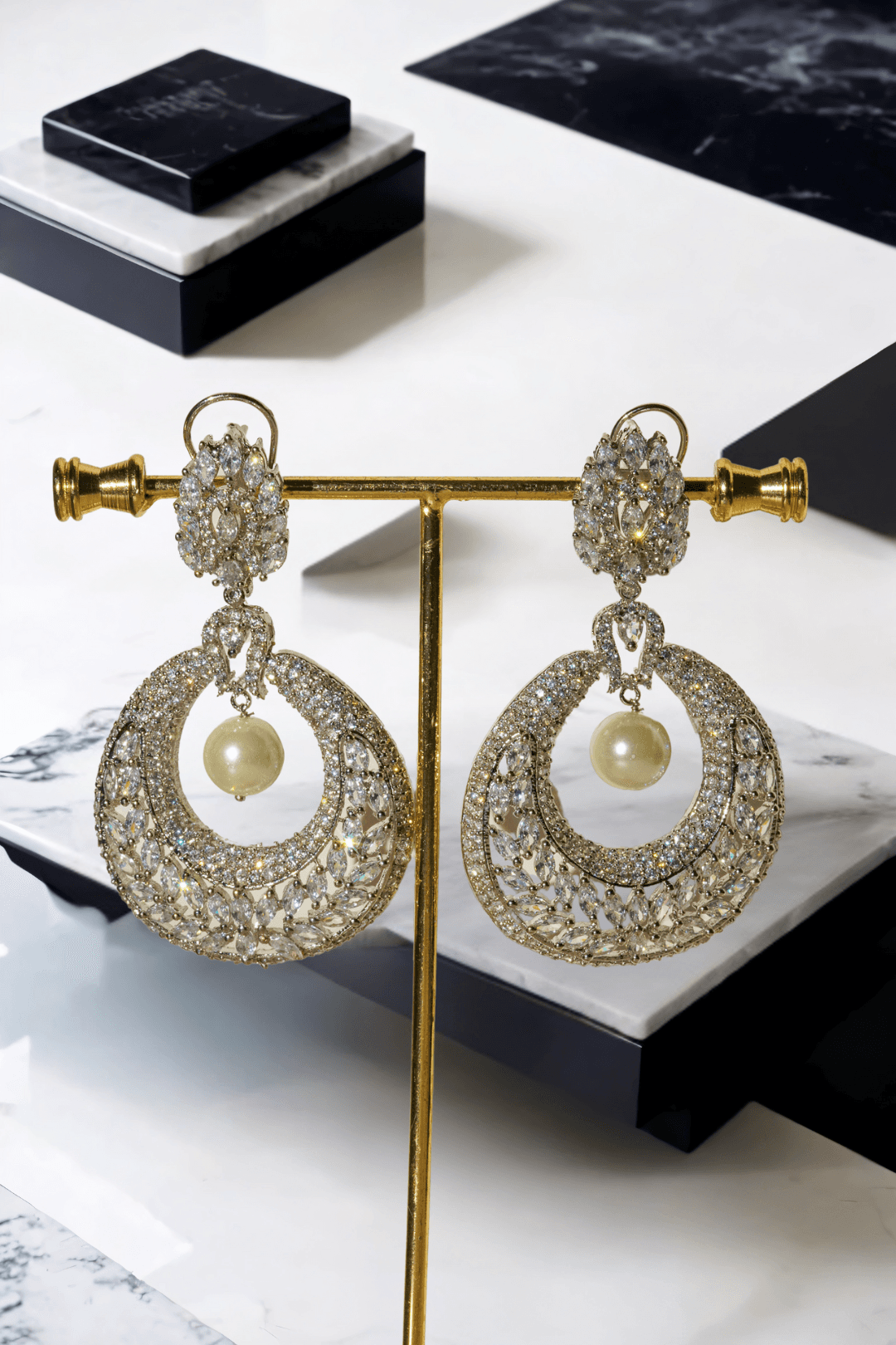 Esmeralda rhodium-plated crescent earrings with white stones and pearl drop, Indian jewelry, 2.8 inches long, for parties and weddings.