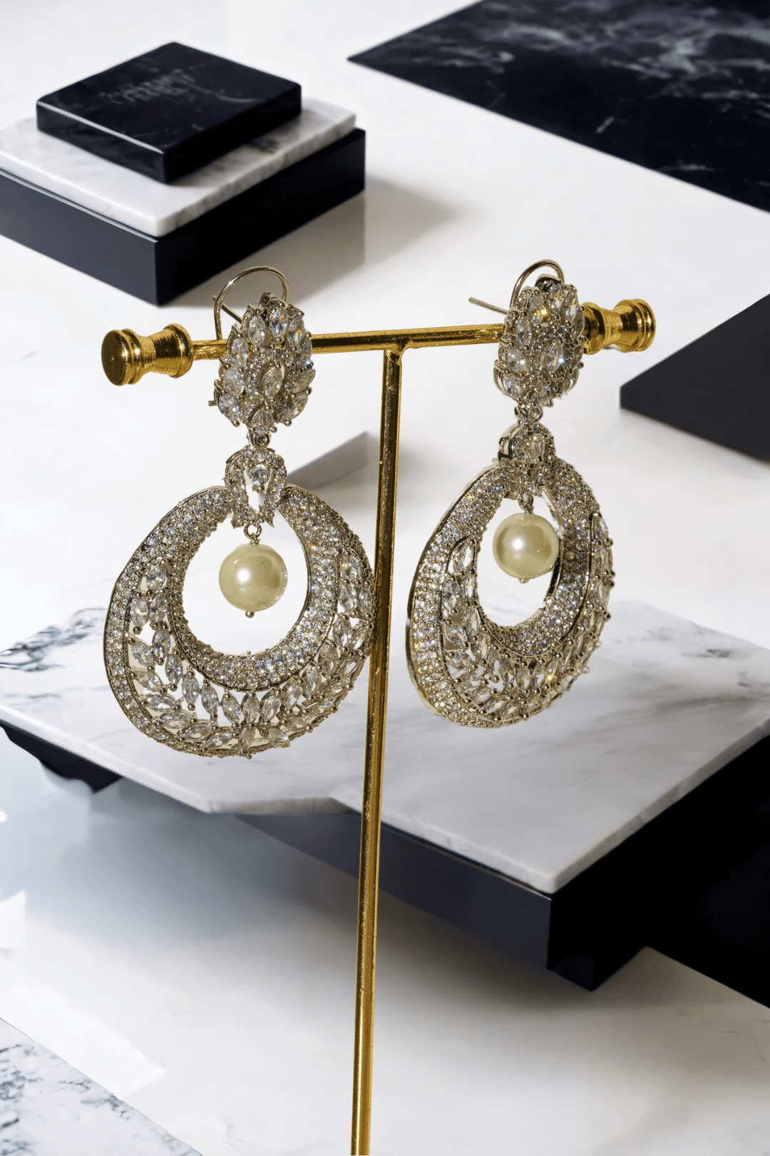 Esmeralda rhodium-plated crescent earrings with white stones and pearl drop, Indian jewelry, 2.8 inches long, for parties and weddings.