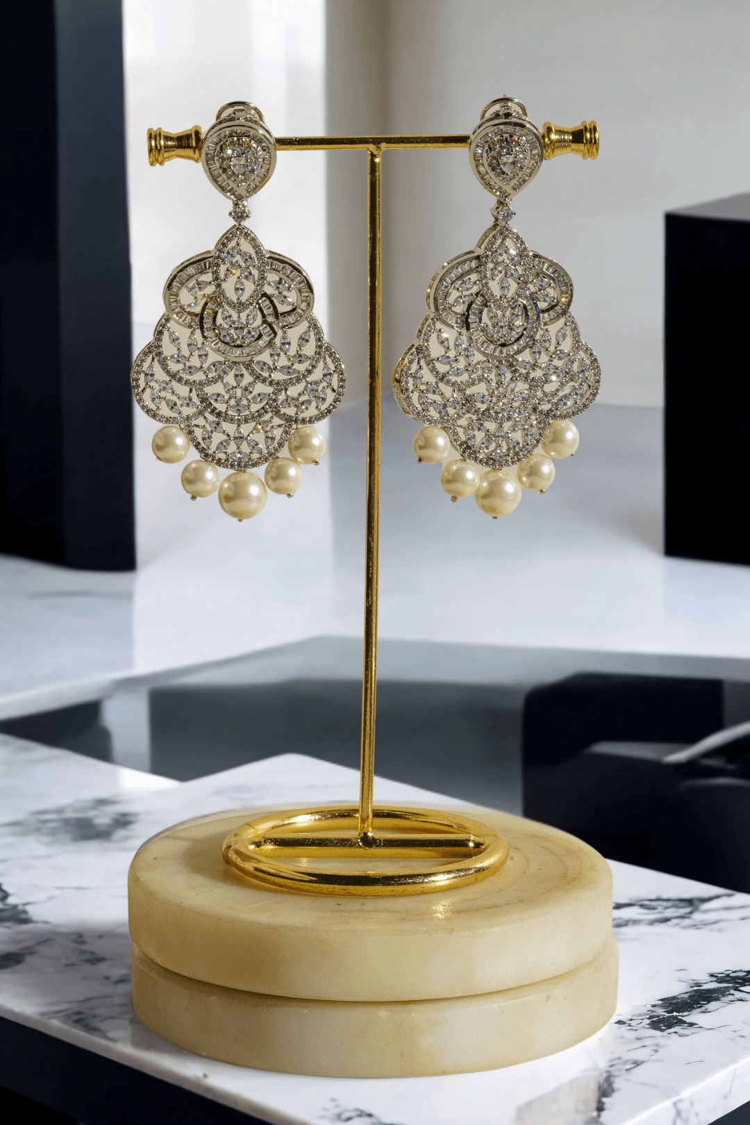 Irene Radiant Pearl Drop Earrings, rhodium-plated with intricate filigree design, pavé white stones, and pearl drops, 3.4 inches long - Indian jewelry for festive and wedding occasions.