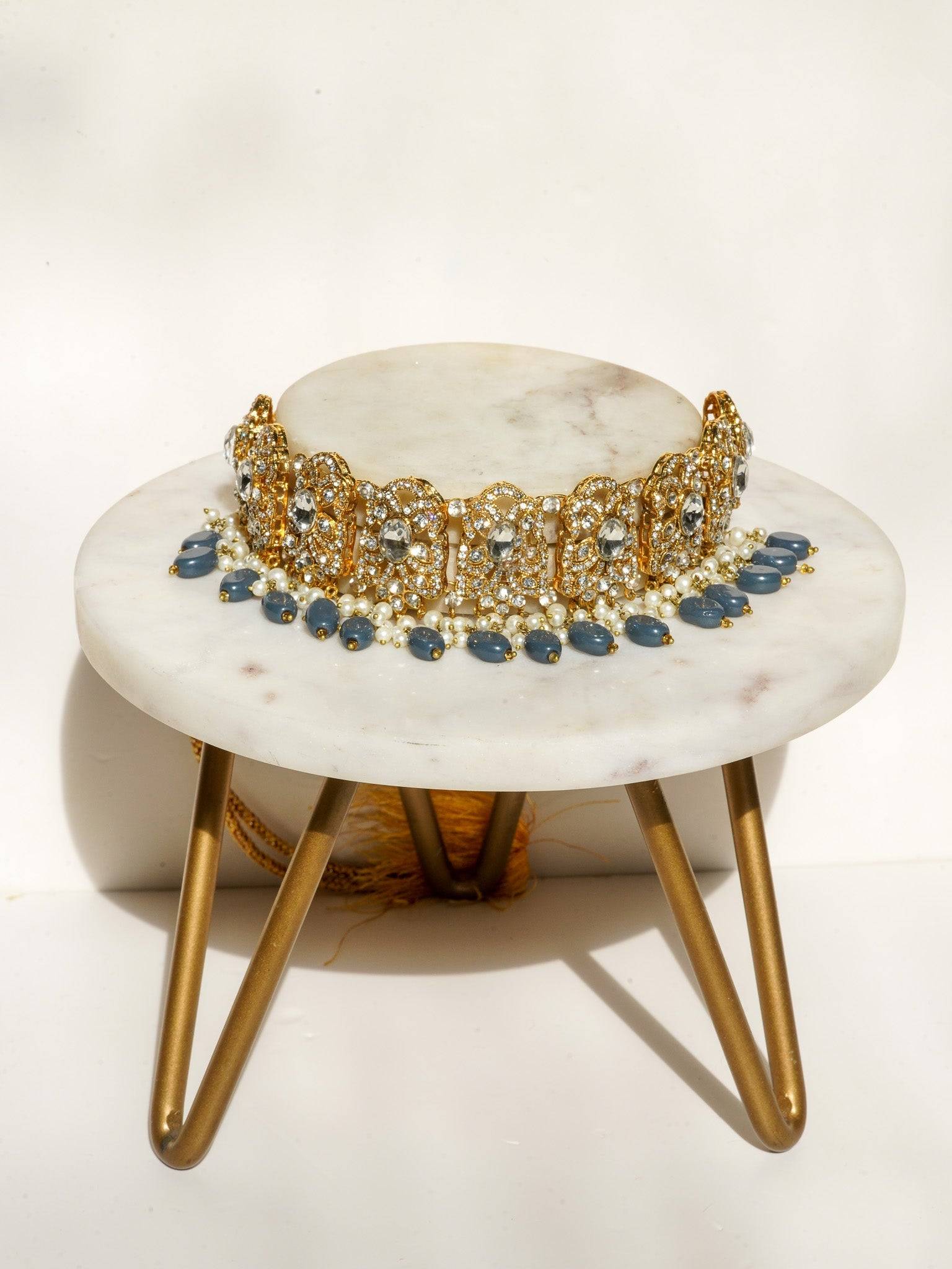 Nazanin Gold Plated Teal Bridal Set - 6-piece collection with gold plating, white zircon stones, teal blue beads, including jhumka earrings, choker, classic necklace, long necklace, jhoomer, and maang tikka.