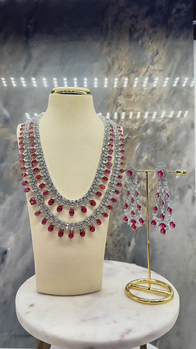 Arni Long Double Layer Diamanté AD Necklace Set - Rhodium-plated silver finish with intricate detailing, available in five colors, includes matching statement earrings.