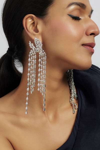 Nikita Statement Earrings - Rhodium plated, oversized 6.1-inch earrings with cascading white stones in a dramatic, elegant design.