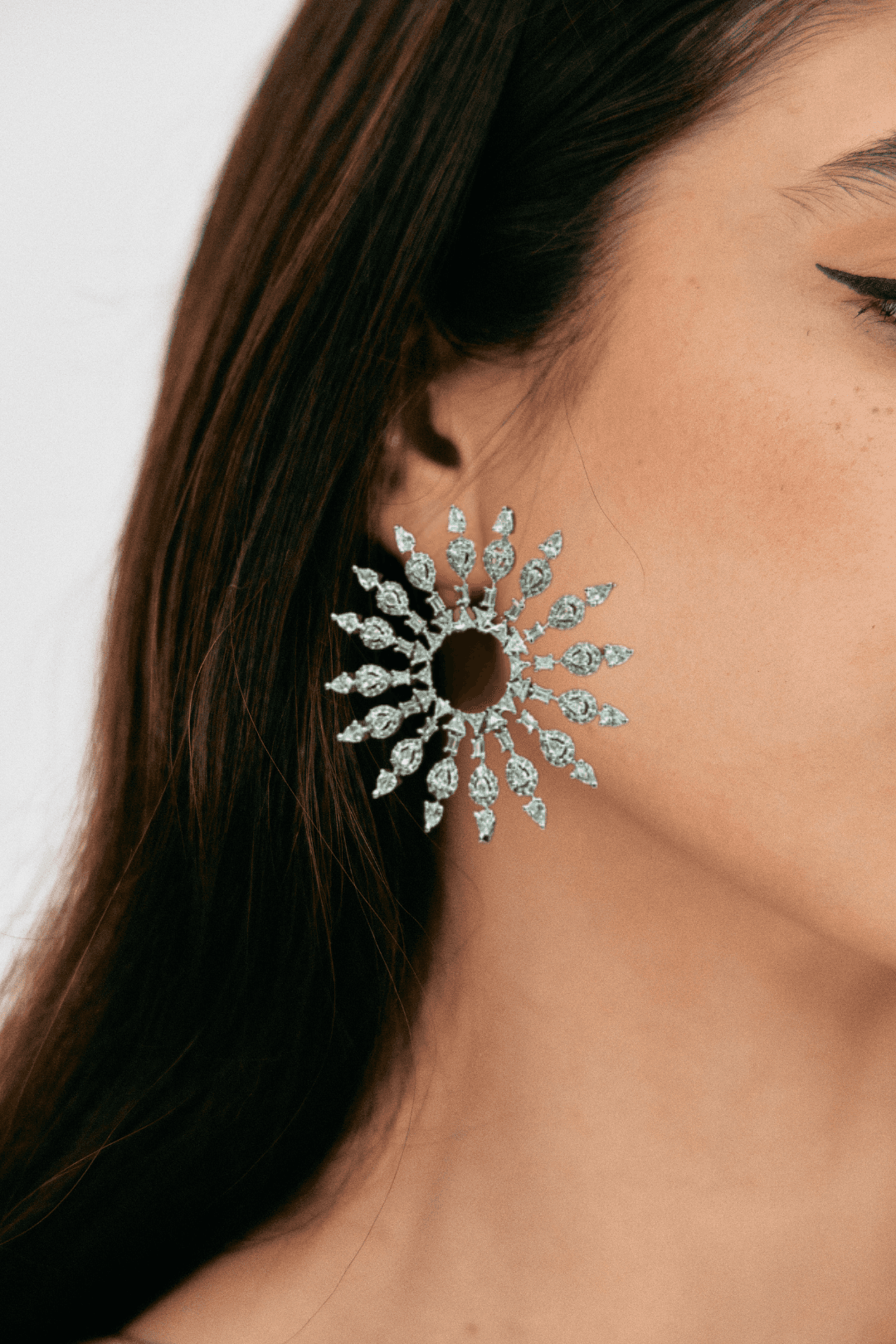 Sitara Earrings - Rhodium-plated starburst statement earrings with pavé-set stones, featuring a 2.3-inch length and elegant hook-back design.