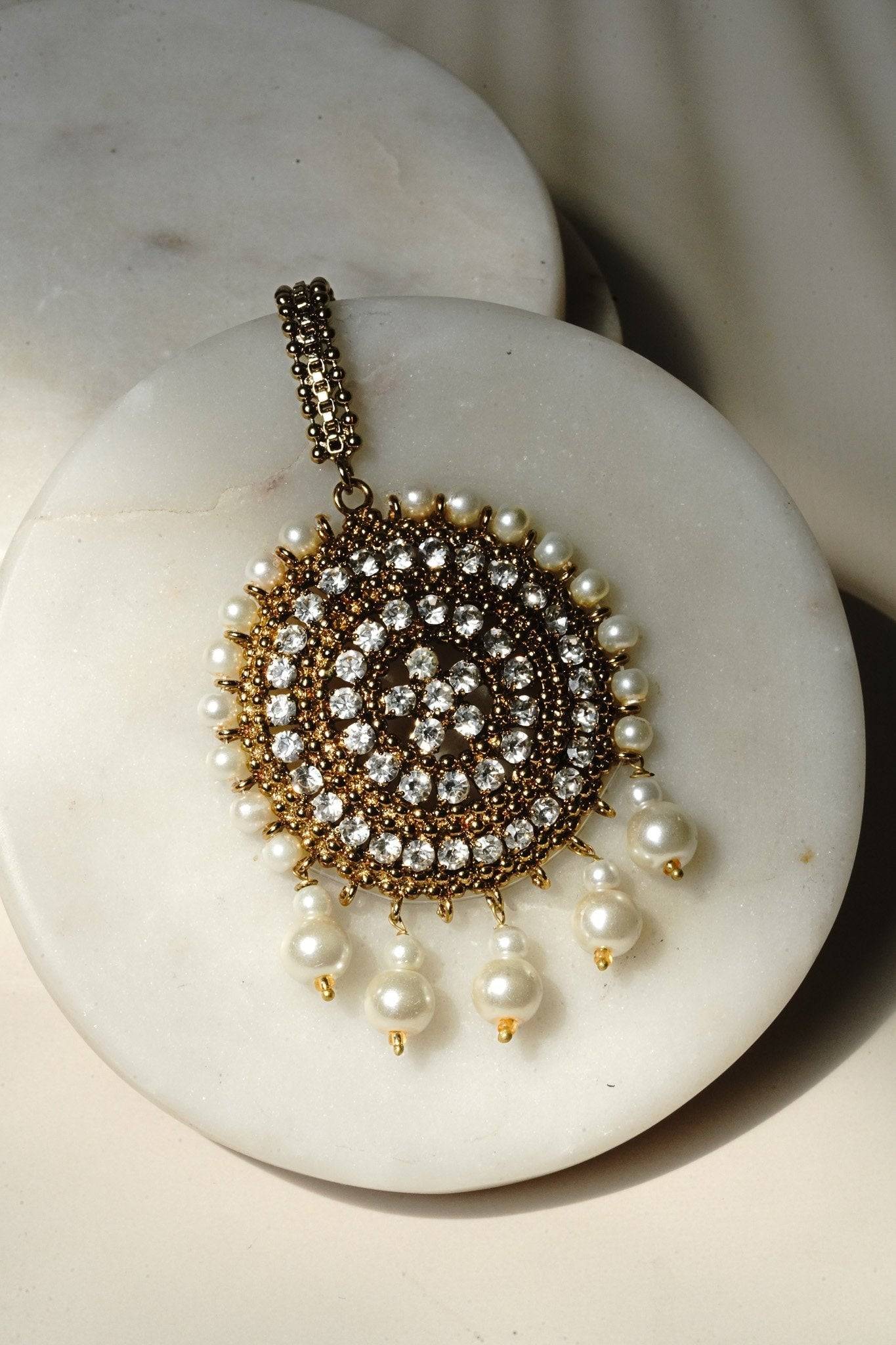 Arooj Handcrafted Pakistani Necklace Set - Antique gold-plated necklace, chandbali earrings, and maang tikka with pearl trim and sparkling white stones.