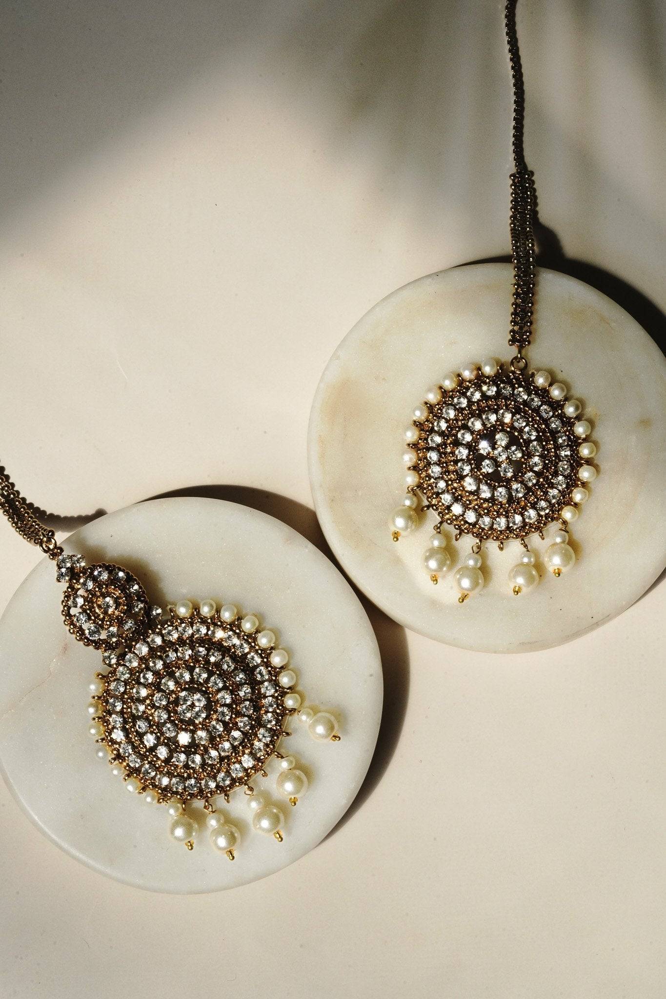 Arooj Handcrafted Pakistani Necklace Set - Antique gold-plated necklace, chandbali earrings, and maang tikka with pearl trim and sparkling white stones.