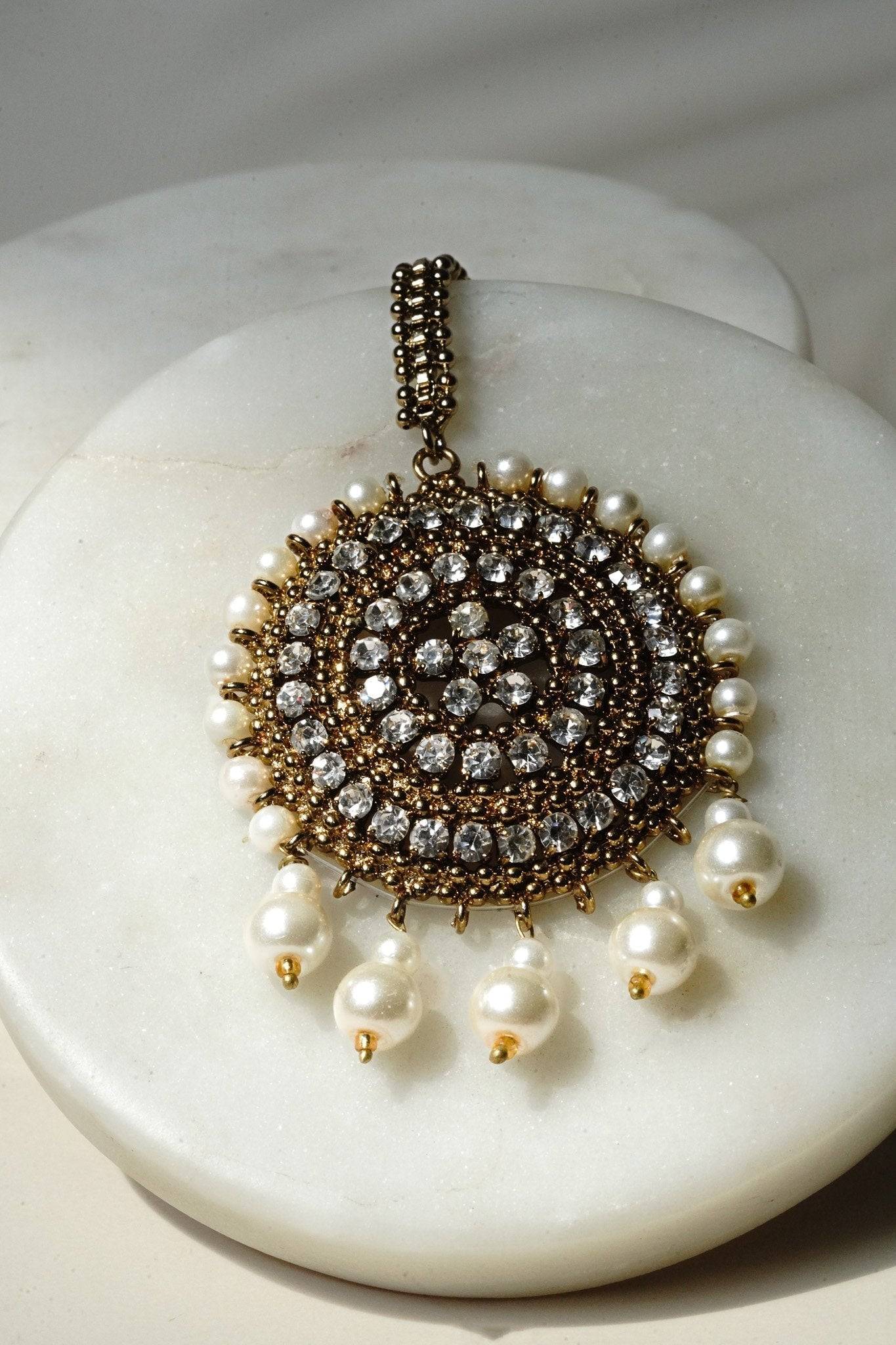 Arooj Handcrafted Pakistani Necklace Set - Antique gold-plated necklace, chandbali earrings, and maang tikka with pearl trim and sparkling white stones.