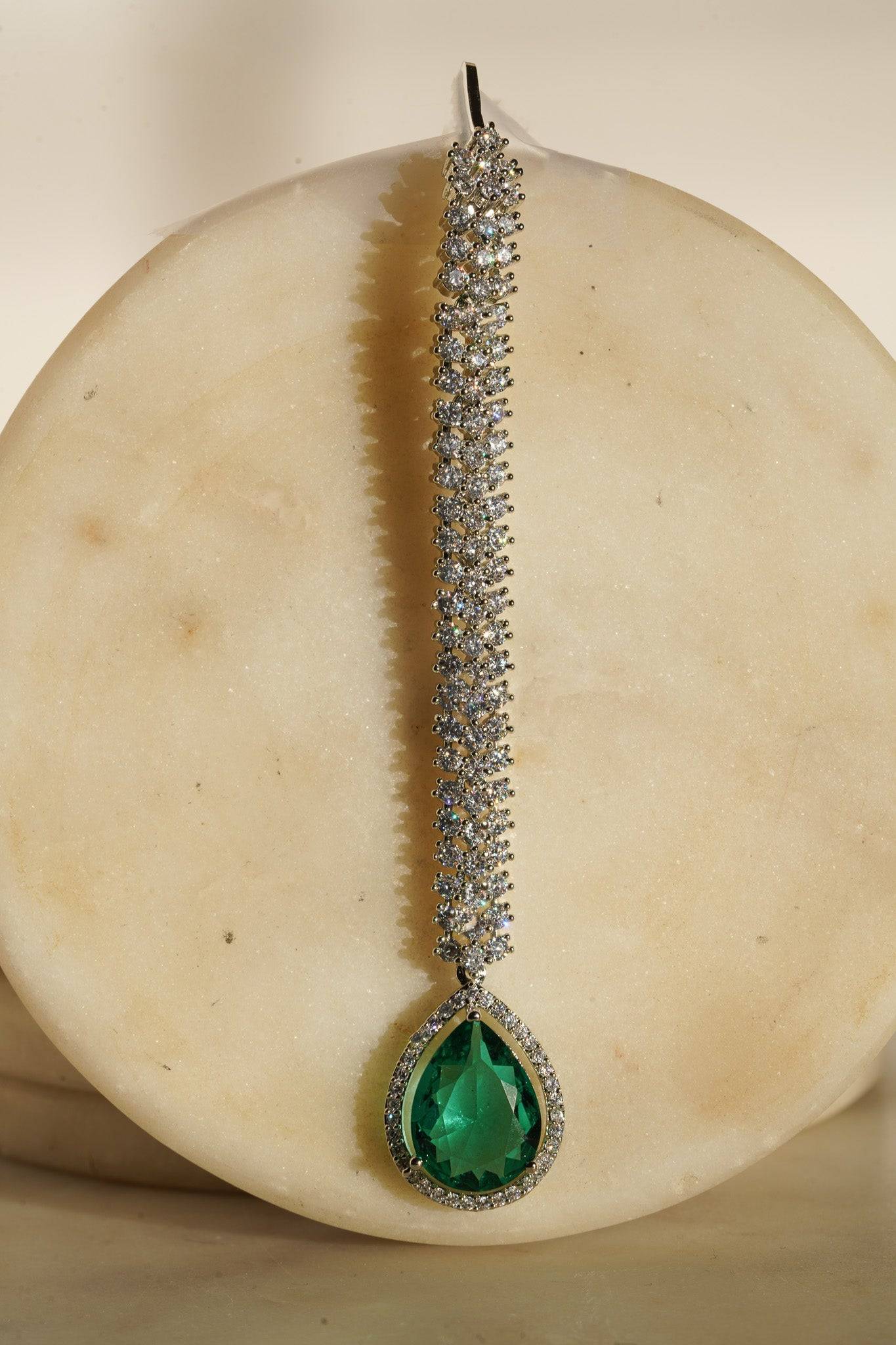 Safi Diamanté Accent Maang Tikka - Rhodium-plated with glistening diamante AD stones, available in emerald green or sapphire blue.