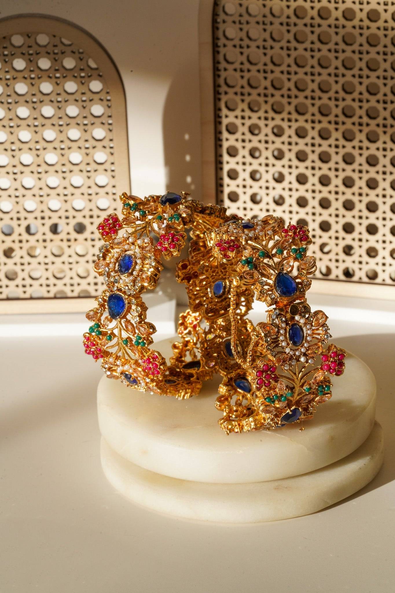 Ziya Intricate Bangles & Bracelets Set of 2 in gold plating with navratan jewelry, featuring multicolor floral and petal patterns, perfect for desi weddings and special occasions.